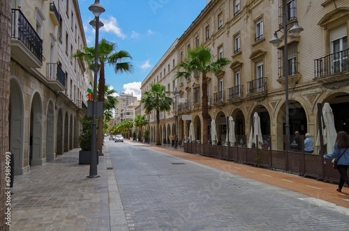 Street city view with cars and traffic, house facades cityscape skyline of Huelva, Spain Cristopher Columbus birth place