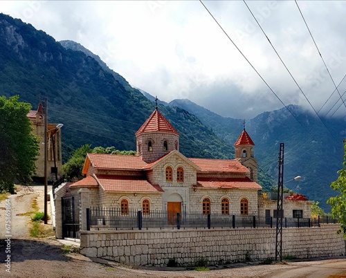 Canvas Print Large brick structure in front of a majestic mountain range in the background