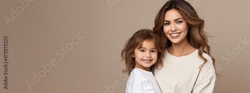 Generative AI image of a young beautiful mother (girl with brown hair, 25-30 years old, in casual white t-shirt) is holding her daughter - a pretty girl of 5 with brown hair and a beautiful smile