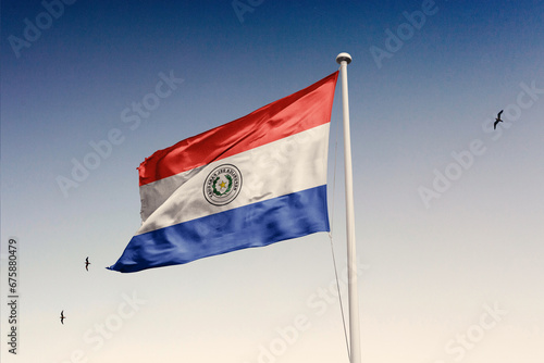 Paraguay flag fluttering in the wind on sky.