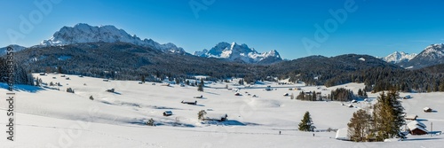 panoramic landscape with mountains in snow at cold winter day