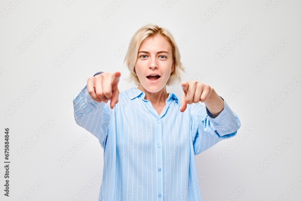 Portrait of confident girl chooses you points finger at camera isolated on white studio background. Welcome gesture, join our team concept. Portrait of confident girl chooses you points finger at camera isolated on white studio background. Welcome gesture, join our team concept.