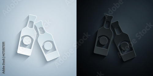 Paper cut Beer bottle icon isolated on grey and black background. Paper art style. Vector