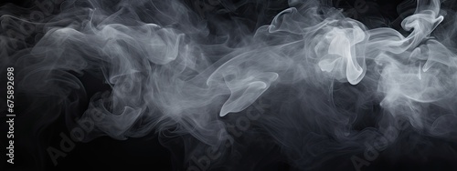 texture of soft transparent white smoke on a black backdrop © valentina