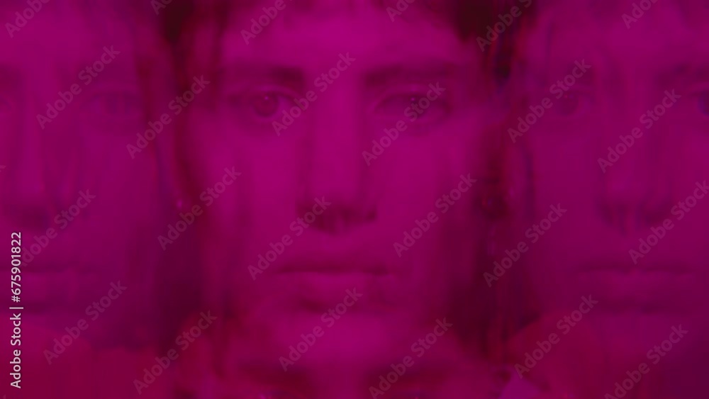 Young sad woman standing in multi-colored neon light, looking at camera through wet window with water flowing down the glass. Kaleidoscope effect, video portrait Young sad woman standing in multi-colored neon light, looking at camera through wet window with water flowing down the glass. Kaleidoscope effect, video portrait