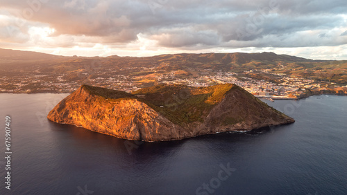 Fototapeta Naklejka Na Ścianę i Meble -  Drone shot of sunset at Monte Brasil Caldeira in the south of the Portuguese island of Terceira in the Azores