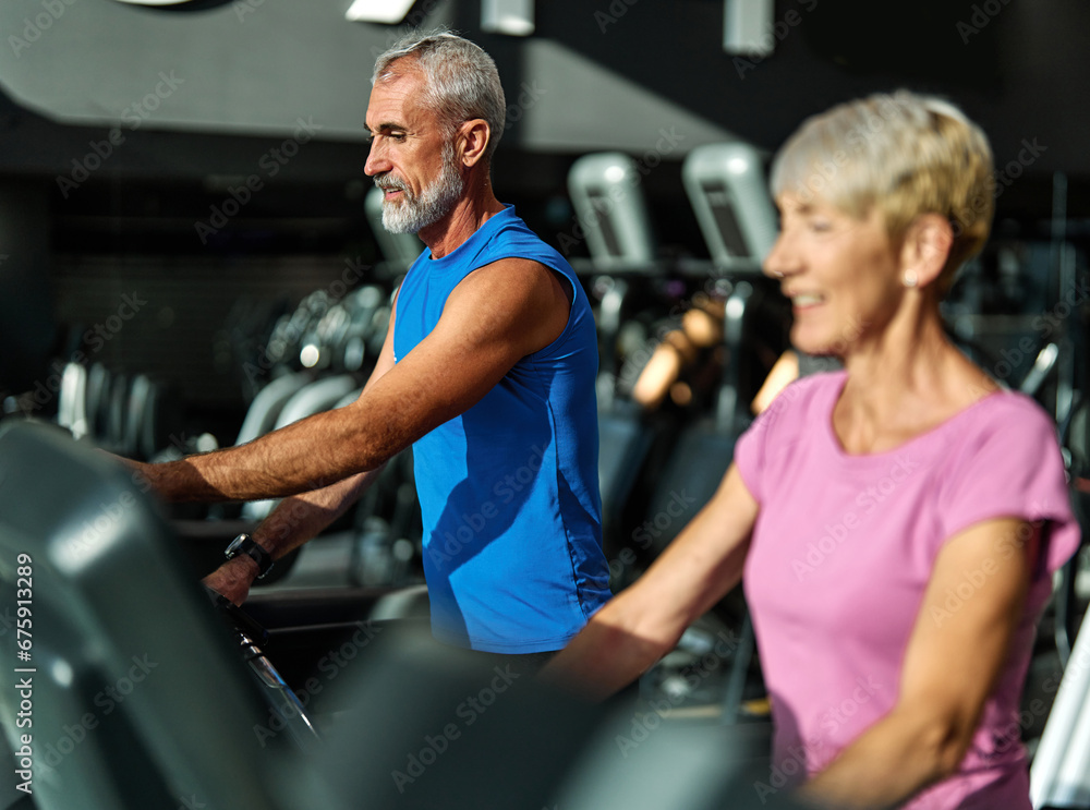 gym sport fitness exercising training mature man running cardio treadmill healthy active man adult woman equipment athletic couple run coach fit endurance gym sport fitness exercising training mature man running cardio treadmill healthy active man adult woman equipment athletic couple run coach fit endurance