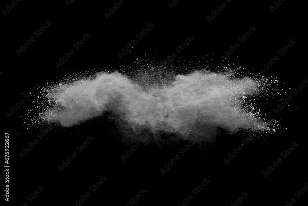 White powder explosion on black background. Colored cloud. Color dust explode. Paint Holi