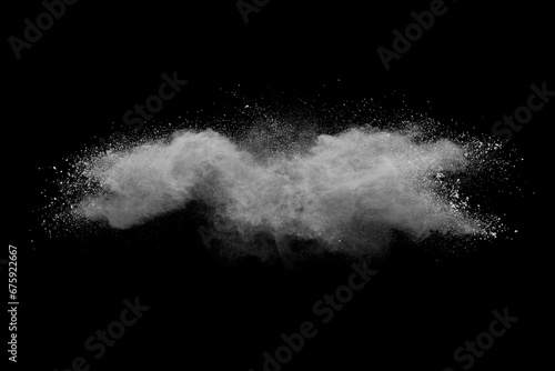 White powder explosion on black background. Colored cloud. Color dust explode. Paint Holi