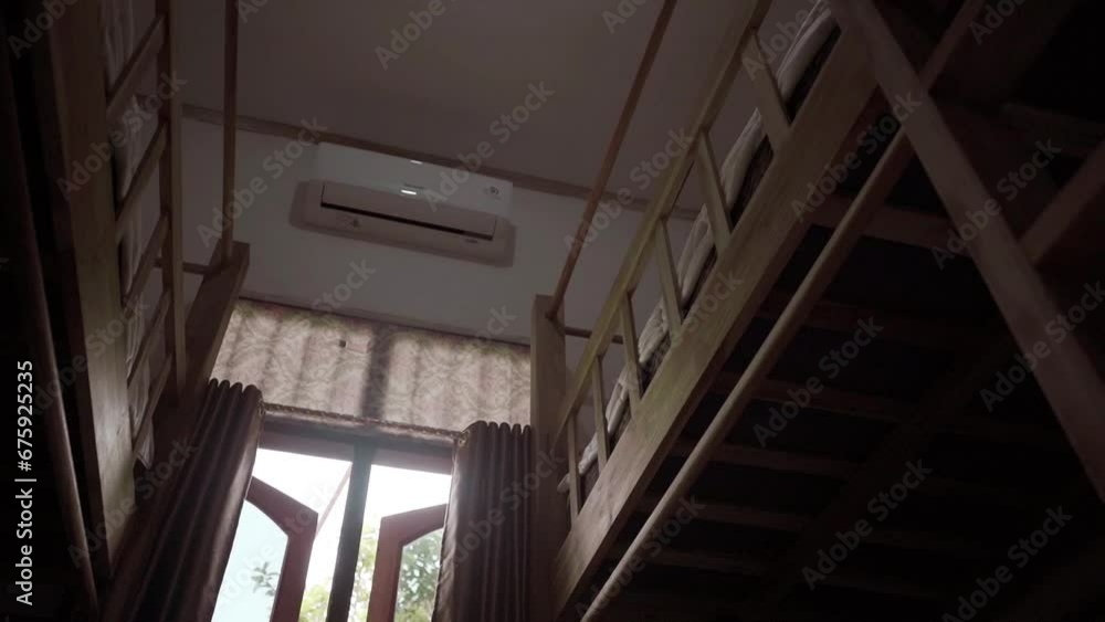 The interior design of the hotel room is minimalist, with wooden bunk beds. classical The interior design of the hotel room is minimalist, with wooden bunk beds. classical