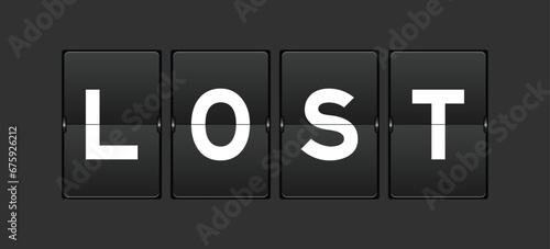 Black color analog flip board with word lost on gray background