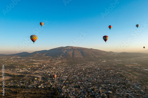 Mexico, sunrise, balloons over the Theotihuan pyramids city of gods