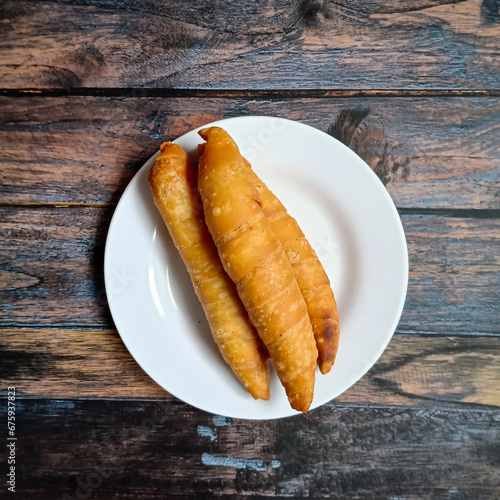 Pisang Molen is a variety of snacks made from bananas which are smeared with flour batter and then fried.