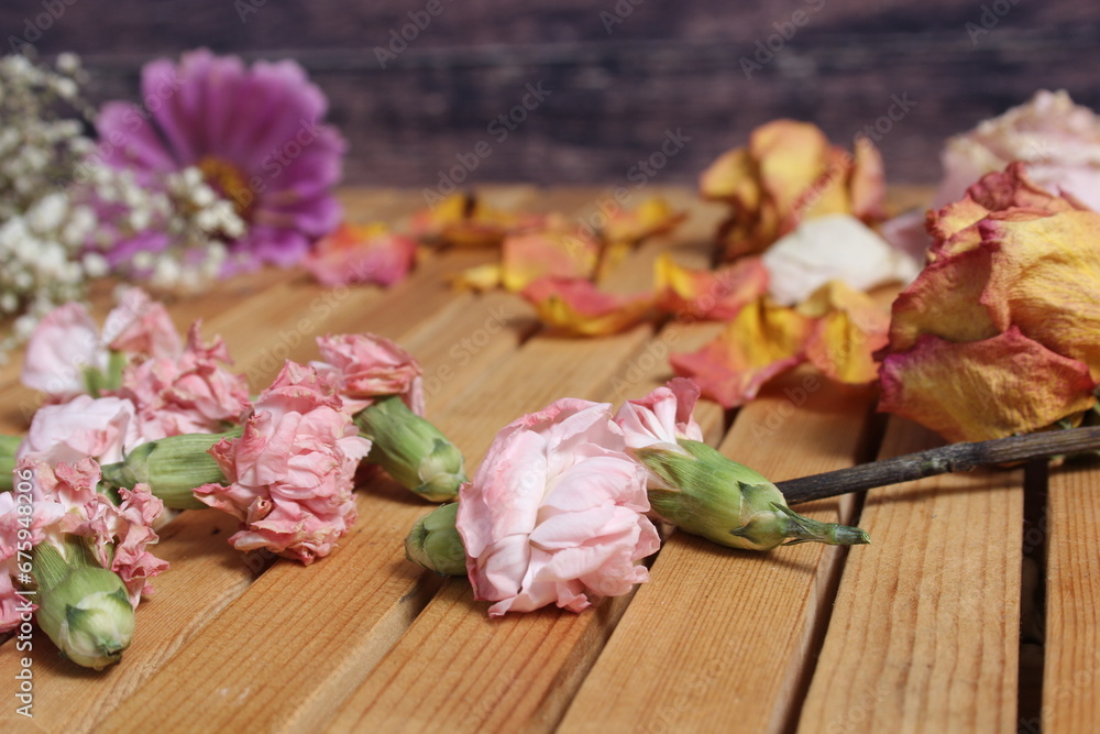 Old Flowers Drying on Wooden Table. Zinnias With Roses and Carnations