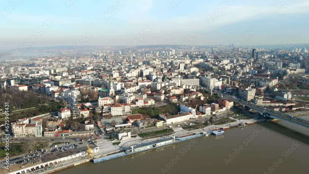Cityscape with bridge over river. Parking lots and building complexes in the morning of autumn day. Cityscape with bridge over river. Parking lots and building complexes in the morning of autumn day.
