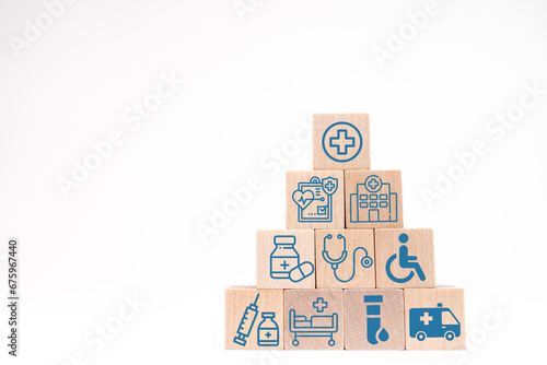 Wooden stacking with healthcare medical and hospital icons on table , Health and insurance concept.