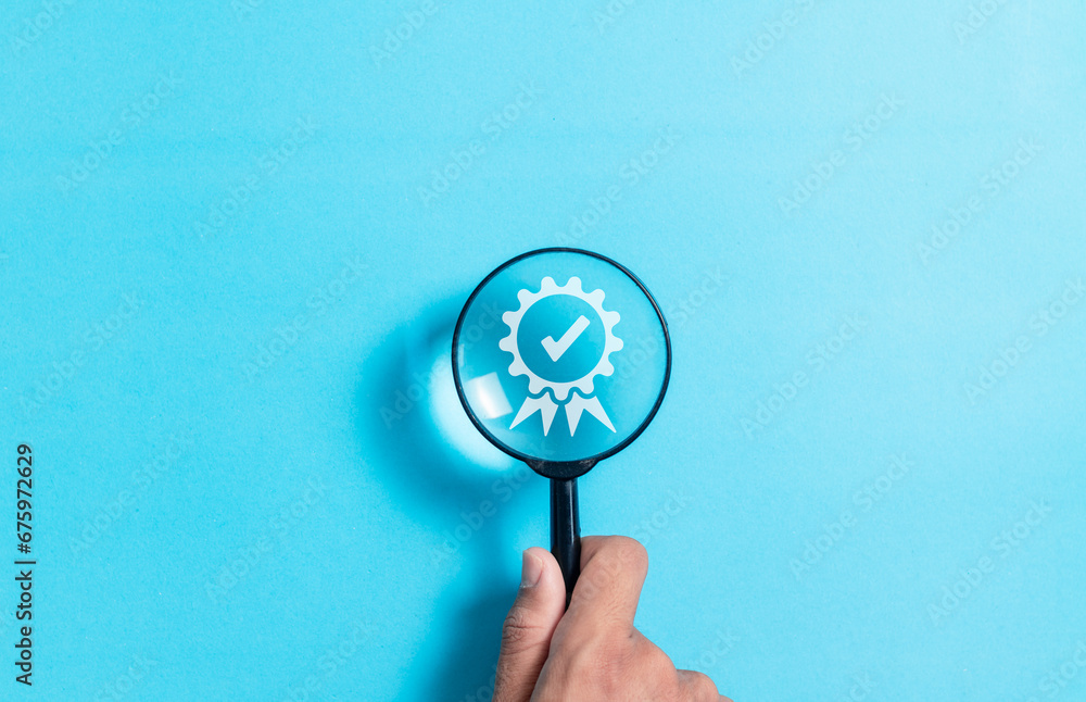 Hand holding magnifying glass focus Quality assurance icon, Guarantee ...