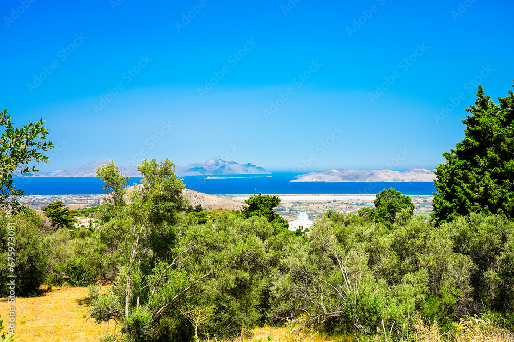 View of the landscape and the Mediterranean Sea from a mountain on the Greek island of Kos.	
