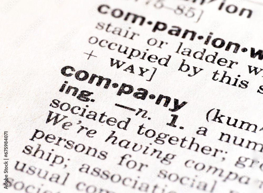 Closeup of the definition of the word company Closeup of the definition of the word company