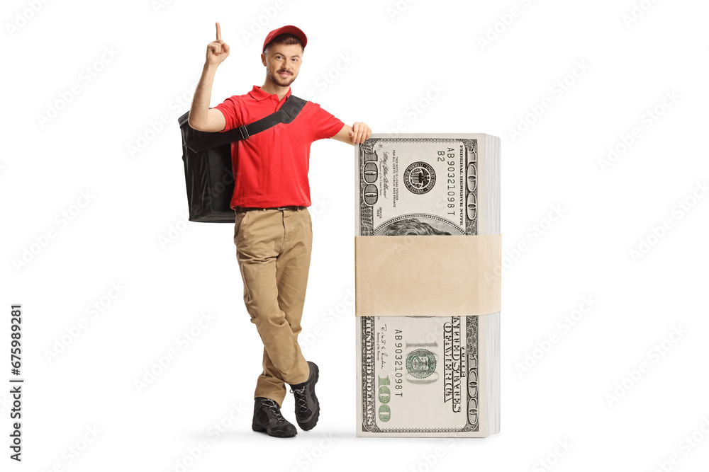 Delivery man leaning on a stack of money and pointing up Delivery man leaning on a stack of money and pointing up