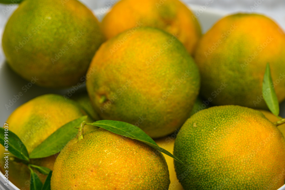 delicious fresh green-orange tangerines as background 1
