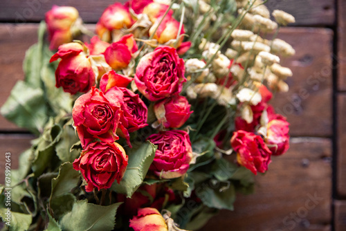 Bouquet of dried flowers on a rustic wooden board