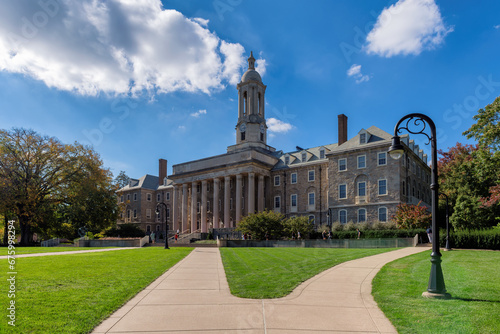 The Old Main building on the campus of  Pennsylvania State University in summer sunny day, State College, Pennsylvania.