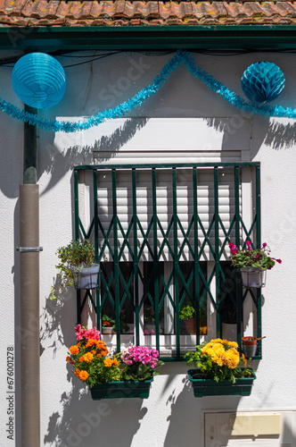 Residential window in Porto city with traditional San Juan festival decorations photo