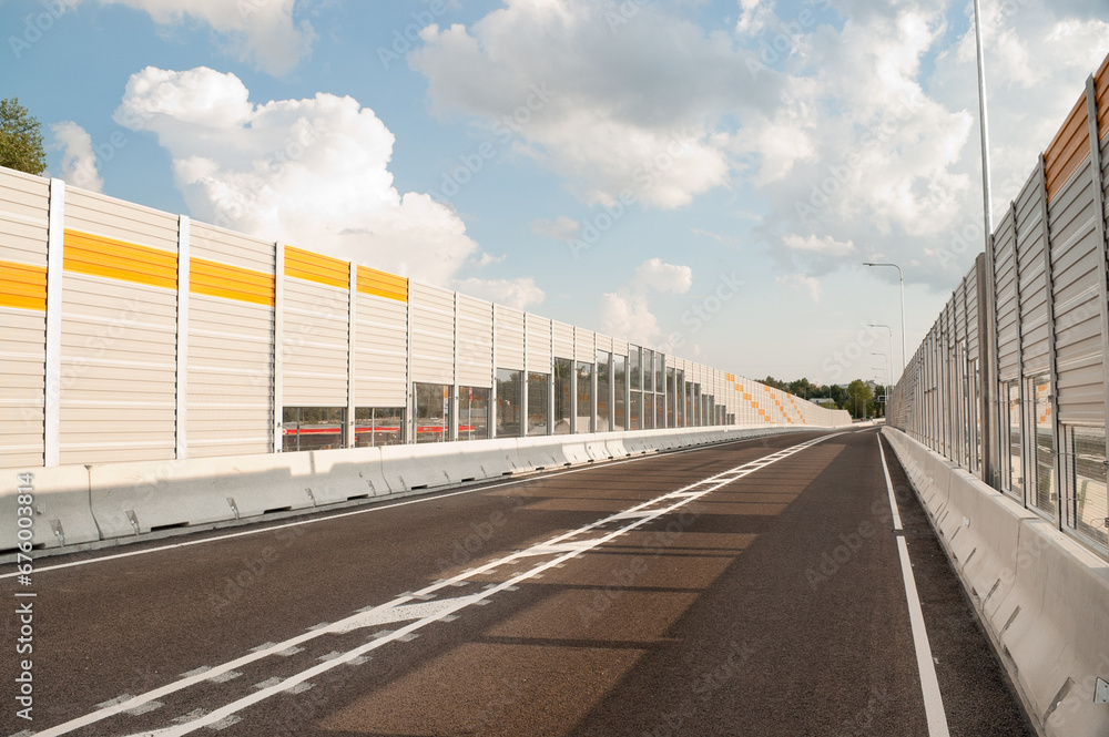 new asphalt road close-up in the background sky and clouds