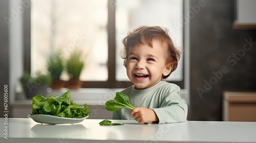  a little boy sitting at a table with a bowl of lettuce and a plate of lettuce leaves.  generative ai