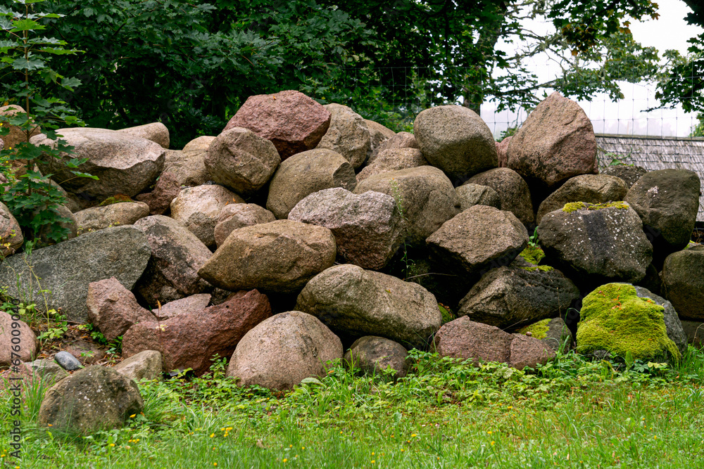 A pile of large granite stones collected from the field. A pile of large granite stones collected from the field.