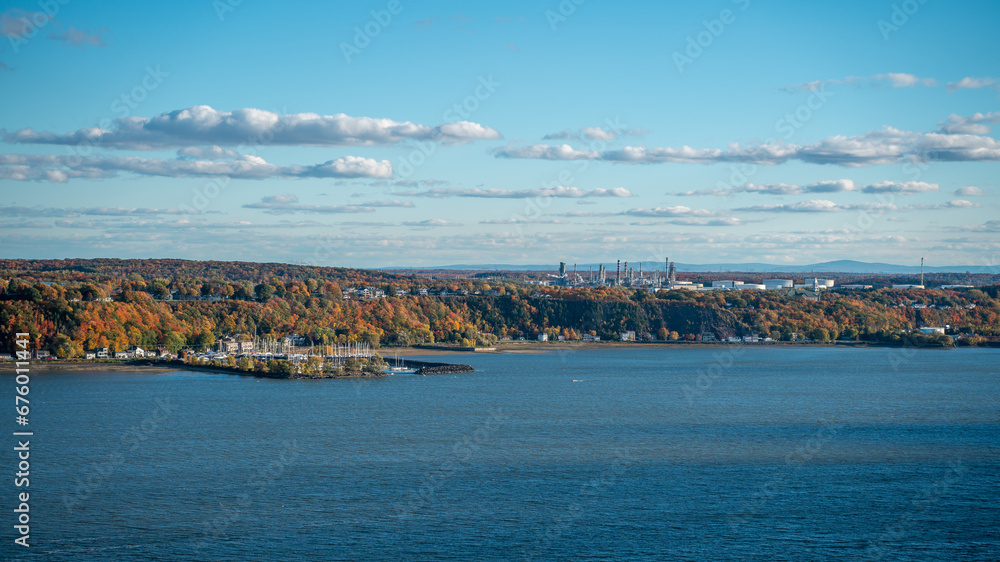 The San Lorenzo river with forest in autumn as seen from Quebec city, Canada 