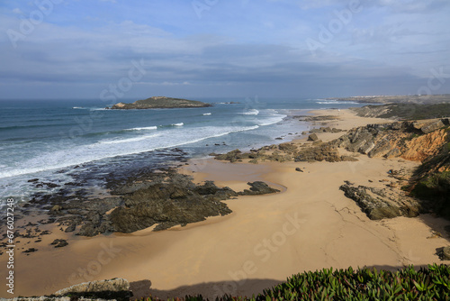 Beautiful Pessegueiro Island beach on a cloudy and windy day in Porto Covo photo
