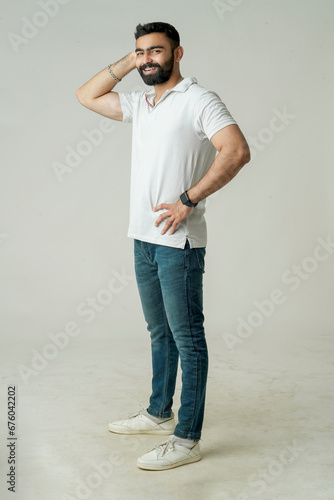 Handsome young guy posing in studio - isolated