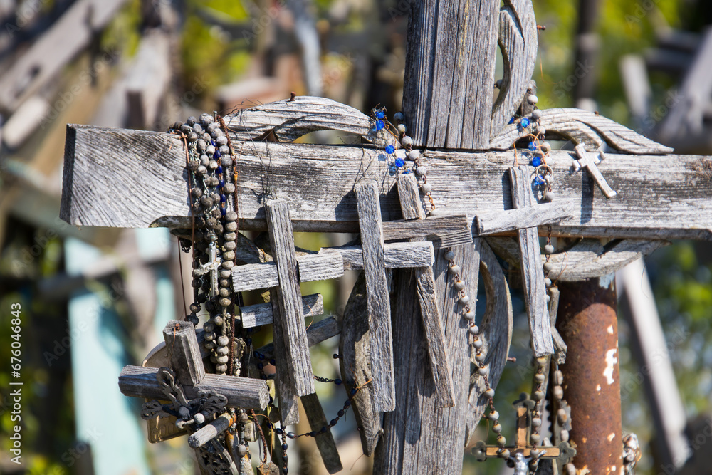 Old wooden cruzifixes at hill of crosses tourism attraction in Lithuania, Baltic States
