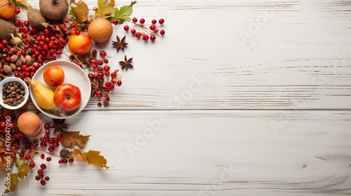 A table setting with delicious fall food. View from above against a backdrop of white wood