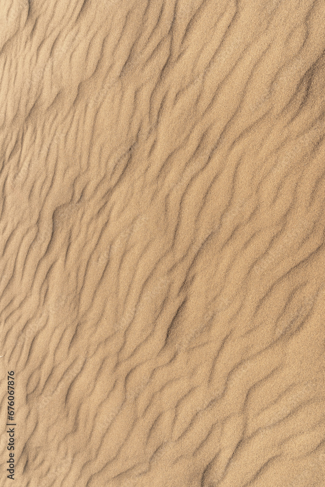 Background of sun-kissed sand, boasting a radiant yellow color palette. Top view, copy space. Background of sun-kissed sand, boasting a radiant yellow color palette. Top view, copy space.
