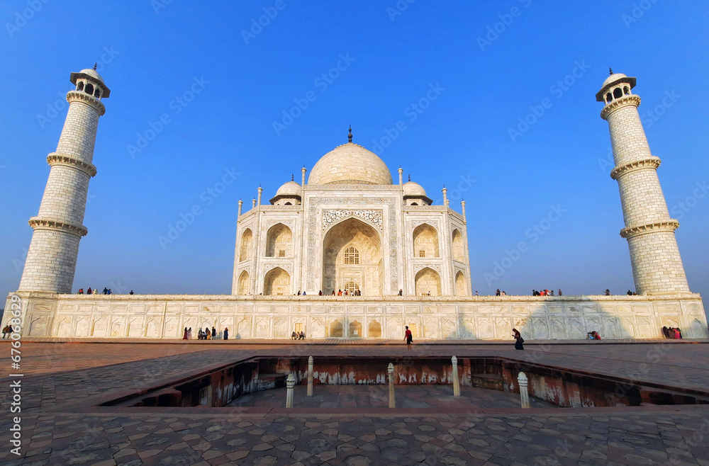  Taj Mahal at sunrise is an ivory-white marble mausoleum on the right bank of the river Yamuna in Agra India
