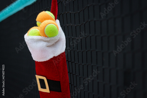 Sporty Christmas Gift: Stocking with Beach Tennis Balls on Net - Copy Space