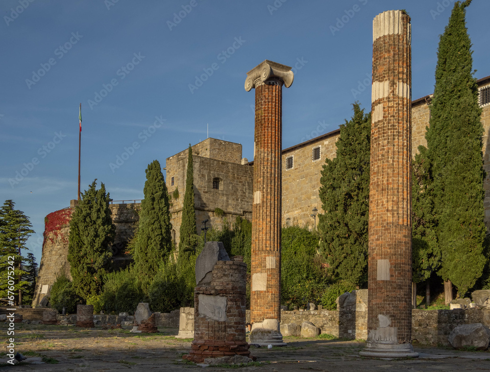 Ruins of the ancient Roman Forum and Basilica (1st century BC) with the medieval Castel San Giusto in the background. San Giusto Hill,Trieste, Friuli Venezia Giulia, northeast Italy