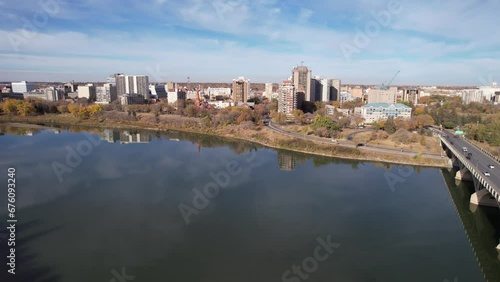 Wallpaper Mural Aerial video of Saskatoon's downtown central business district, SK, Canada. Skyline view reveals bustling urban life, commercial buildings, and roads. Ideal for business concepts. Torontodigital.ca