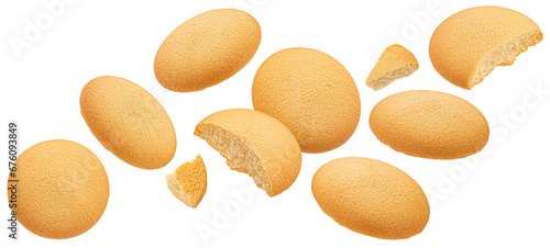Falling sponge cakes, butter cookies isolated on white background photo