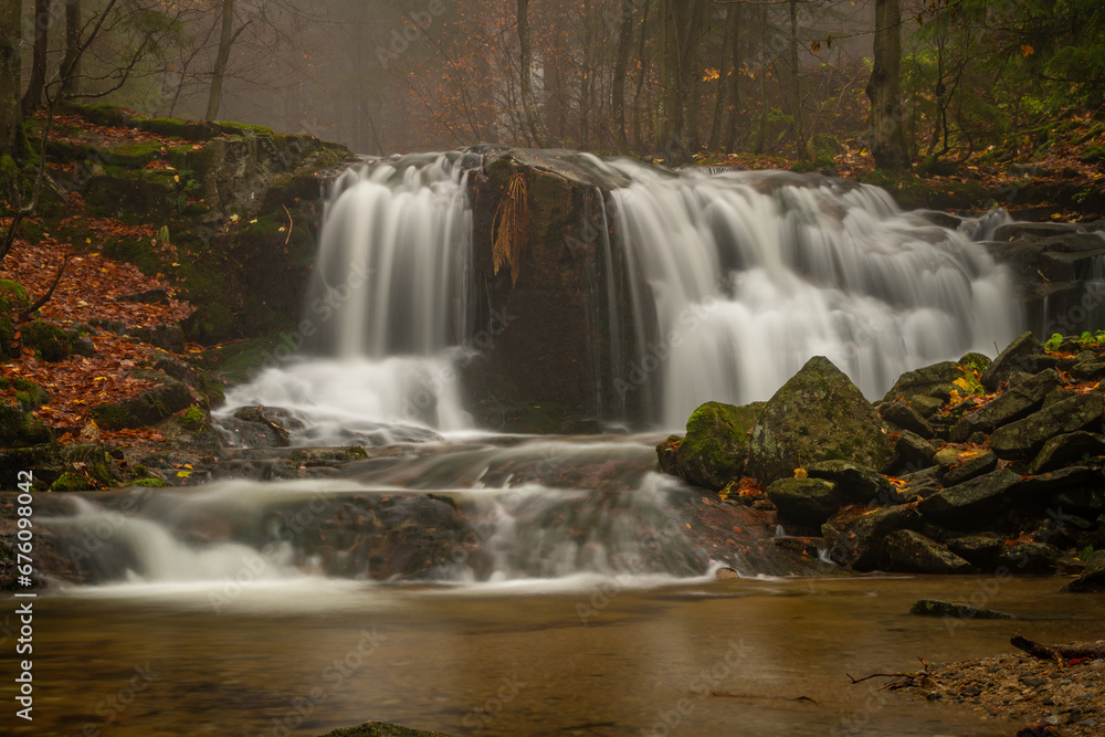 Fototapeta premium Ponikly waterfall with flood water after night rain in autumn morning
