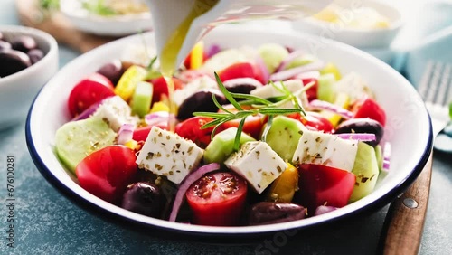 Greek salad. Vegetable salad with feta cheese, tomato, olives, cucumber, red onion and olive oil. Healthy vegetarian mediterranean diet food. Video 4k