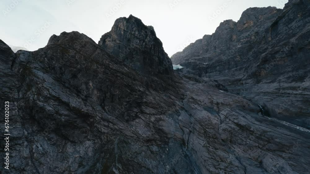 Cinematic FPV of Switzerland alps in Grindelwald, fast pace flying like a bird amazing view of mountain peaks in distance. Cinematic FPV of Switzerland alps in Grindelwald, fast pace flying like a bird amazing view of mountain peaks in distance.
