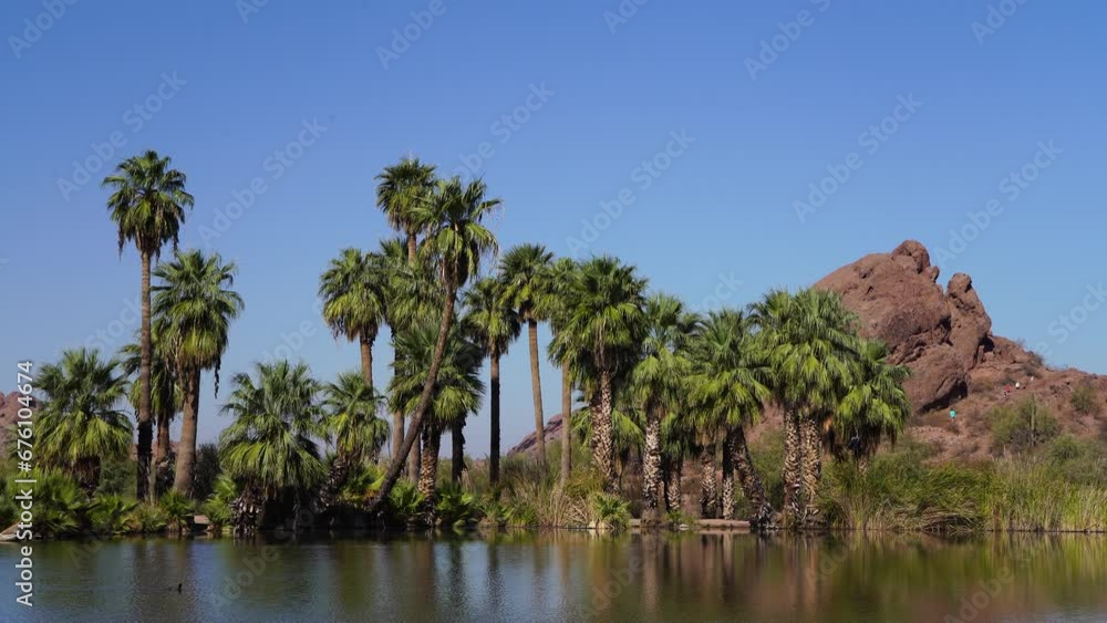 Papago Park in Phoenix Arizona, America, USA. The park features uniques mountains, palm trees and several pond for wildlife and fishing. Papago Park in Phoenix Arizona, America, USA. The park features uniques mountains, palm trees and several pond for wildlife and fishing.