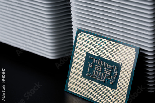 odern personal computer processor – CPU, white metal radiator for cooling it. Heat dissipation, thermal conductivity and processor cooling. Socket LGA 1700. High-end cooling system. Photo. photo