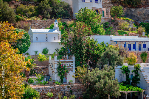 A church, a dovecote and other whitewashed buildings in Kardiani village, Tinos, Cyclades, Greece. photo