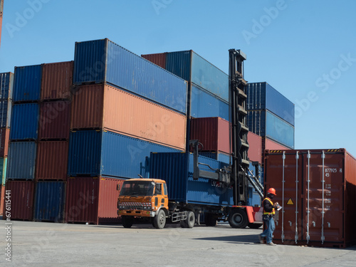 container crane loading truck box blue cargo business container commercial delivery dock box economy equipment import export freight transportation global metal shipment stack steel trade technology 