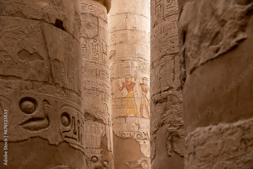 ancient Egyptian hieroglyphs on massive columns of hippostyle hall in karnak temple in luxor, egypt